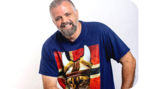 Storyteller Chad Filley smiling while wearing a Norse shirt featuring a cat